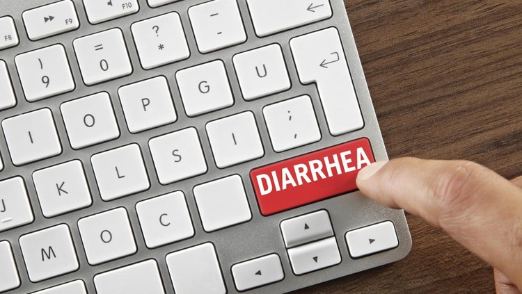 Man pushing ”Diarrhea” key on computer keyboard.