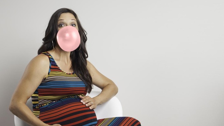 Pregnant woman with bubble gum