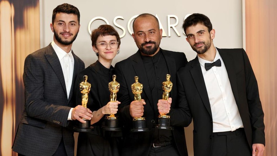 HOLLYWOOD, CALIFORNIA - MARCH 02: (L-R) Basel Adra, Rachel Szor, Hamdan Ballal, Yuval Abraham, winners of the Best Documentary Feature Film for “No Other Land”, pose in the press room during the 97th Annual Oscars at Ovation Hollywood on March 02, 2025 in Hollywood, California. (Photo by Mike Coppola/Getty Images)