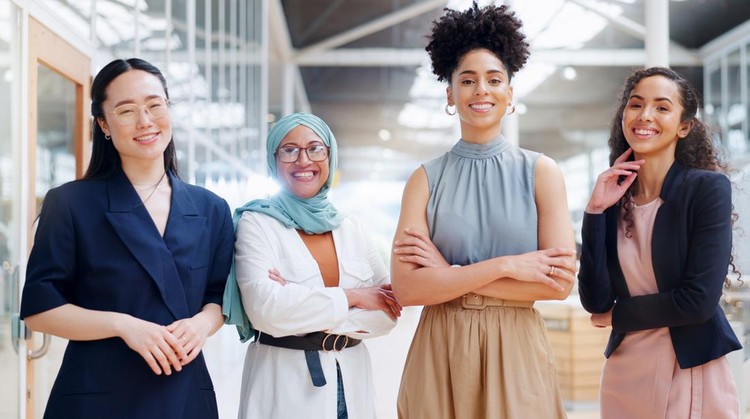 Diversity, empowerment and portrait of team of women at creative marketing startup company. Teamwork, diversity and confident group of women with focus, smile and ideas in advertising industry office