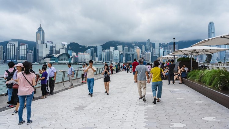 Hong Kong, China, June 02, 2019: Tourists visiting the Avenue of the Stars. The Avenue of Stars is located along the Victoria Harbor in Hong Kong. And reopen in 2019
