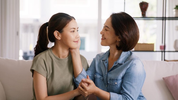 Ibu dan anak Middle aged asia people old mom love care trust comfort help young teen talk crying stress relief at home. Mum as friend listen adult child woman feel pain sad worry of broken heart life crisis issues