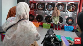 FOTO: Geliat Jasa Laundry Pakaian di Masa Lebaran