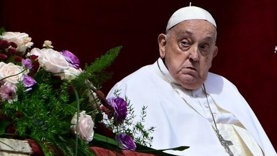 Pope Francis stands on the main balcony of St&period; Peter's basilica during the Urbi et Orbi message and blessing to the city and the world as part of Easter celebrations&comma; at St Peter's square in the Vatican on April 20&comma; 2025&period; &lpar;Photo by Tiziana FABI &sol; AFP&rpar;