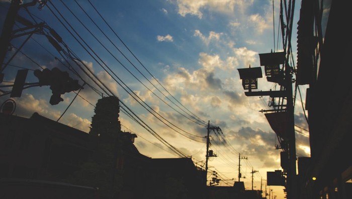 A horizontal shot of a street in Kawagoe, Japan during sunset with the sky in the background