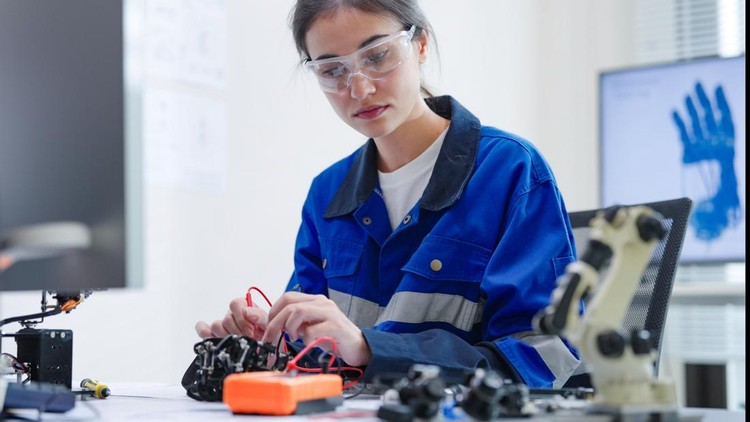 Ilustrasi engineer developer White woman engineer developer wearing safety protective goggles with blue work jacket is soldering intricate robotic components on a circuit board or an electronic device workshop in a laboratory room