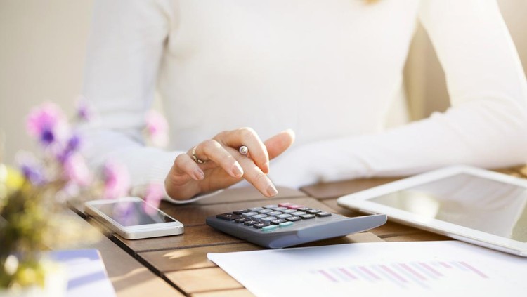 Businesswoman using calculator