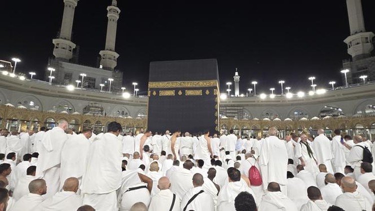 The photo depicts the spiritual activities of the Hajj and Umrah pilgrims in the holy land of Mecca&period; Muslims perform worship and pray in front of the Kaaba&period;