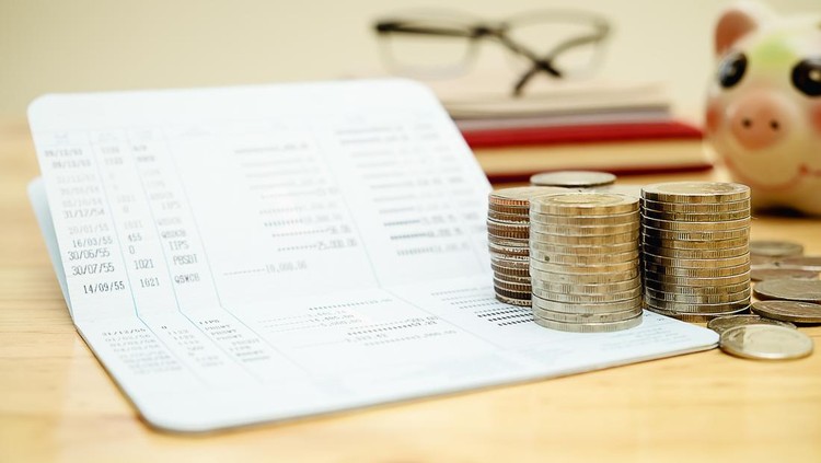 Row of coins,calculator with account book finance and banking concept for background.concept in grow and walk step by step for success in business. concept of saving money.select focus