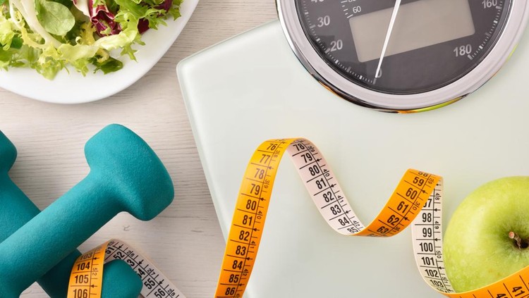 Conceptual healthy life background with dumbbell scales and healthy food&period; Top view&period; Horizontal composition&period;