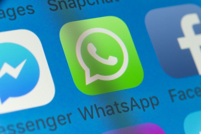London, UK - August 01, 2018: The buttons of WhatsApp, Facebook, Messenger, Snapchat and Messages on the screen of an iPhone.