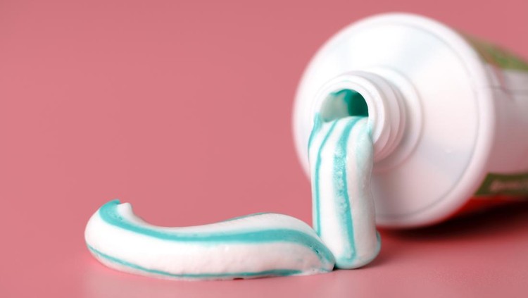Toothpaste in the shape of question mark coming out from toothpaste tube. Brushing teeth dental concept. 3d illustration