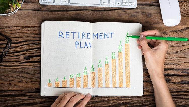 Elevated View Of A Human Hand Drawing Retirement Plan Growth Concept On Notebook