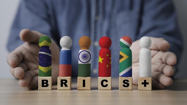 Brazil Russia India China South Africa and white flag  print screen on wooden figure for BRICS plus economic international cooperation concept.
