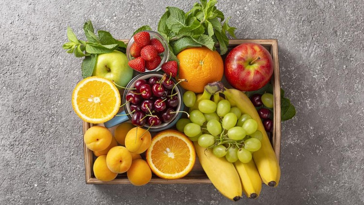 Set of summer fruits and berries in wooden serving.