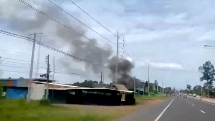 Smoke rises from a structure, amid the clashes between Thailand and Cambodia, in Kantharalak district, Sisaket province, Thailand, July 24, 2025, in this screengrab obtained from a handout video. TPBS/Handout via REUTERS    THIS IMAGE HAS BEEN SUPPLIED BY A THIRD PARTY. THAILAND OUT. NO COMMERCIAL OR EDITORIAL SALES IN THAILAND.