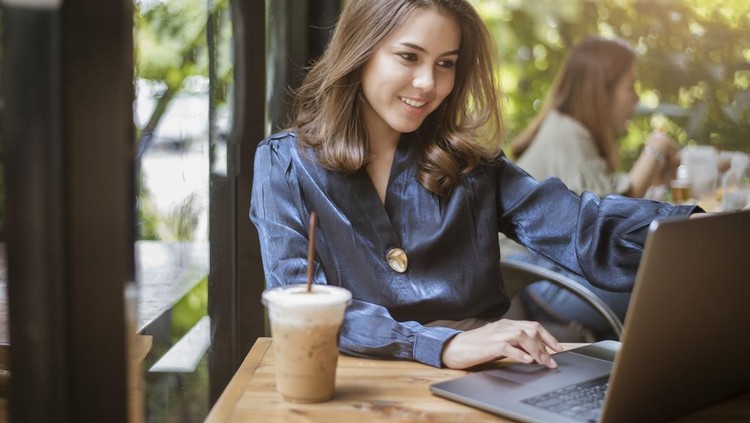 Smart business woman is working with computer
