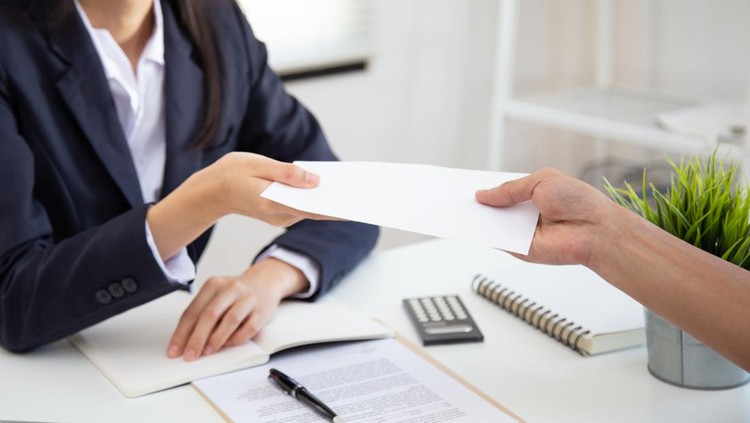Close up view of Young Asian business woman receiving salary or bonus money from boss or manager at office happily.