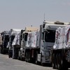 Trucks carrying humanitarian aid line up near the Rafah border crossing between Egypt and the Gaza Strip, in Rafah, Egypt, August 6, 2025. REUTERS/Amr Abdallah Dalsh     TPX IMAGES OF THE DAY