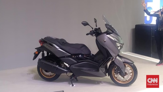 Yamaha Xmax Techmax kini punya fitur Electric Adjustable Screen dan layar klaster kini digabung menjadi satu.