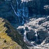 Water from melting ice runs down the side of the Turtmann glacier on a warm summer day, amid climate change, in Turtmann, Switzerland, September 3, 2025. Picture taken with a long exposure. REUTERS/Denis Balibouse