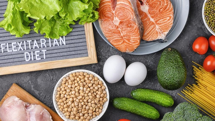 A set of products for a flexible diet. Salmon steak, chicken, chickpeas, mung beans and vegetables on a black background.