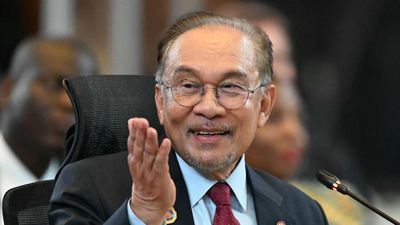 Malaysia's Prime Minister Anwar Ibrahim gestures during remarks at the 20th East Asia Summit during the 47th Association of Southeast Asian Nations (ASEAN) Summit in Kuala Lumpur on October 27, 2