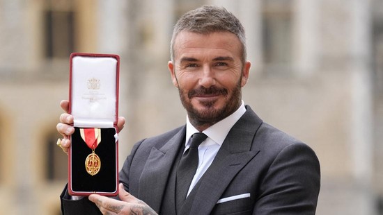 Sir David Beckham stands after he was made a Knight Bachelor at an investiture ceremony at Windsor Castle, Berkshire. November 4, 2025. Andrew Matthews/Pool via REUTERS