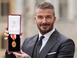 Sir David Beckham stands after he was made a Knight Bachelor at an investiture ceremony at Windsor Castle, Berkshire. November 4, 2025. Andrew Matthews/Pool via REUTERS