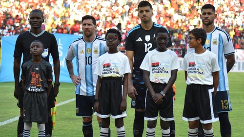 Argentina's forward #10 Lionel Messi (2nd L) stands with Argentina's goalkeeper #12 Geronimo Rulli (3rd L) before the friendly match between Angola and Argentina in Luanda on November 14, 2025. Football icon Lionel Messi created the first goal and sc