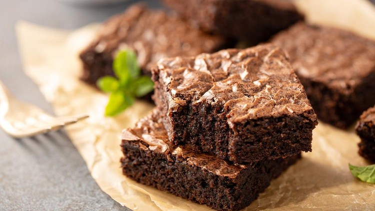 Freshly baked homemade brownies on a parchment paper