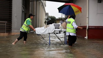 FOTO: 18 Ribu Orang Mengungsi Akibat Banjir di Malaysia