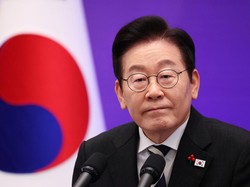 South Korean President Lee Jae Myung listens to a reporter’s question during a press conference to mark the first anniversary of the December 3, 2024, martial law declaration by former President Yoon Suk Yeol, at the Blue House in Seoul, South Kore