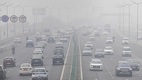 Traffic moves along a highway amidst air pollution in New Delhi, India, December 18, 2025. REUTERS/Adnan Abidi