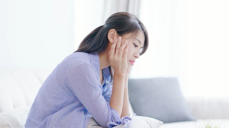 The depression woman think something at home