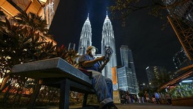 Petronas Twin Towers in Kuala Lumpur. (Photo by MOHD RASFAN / AFP)