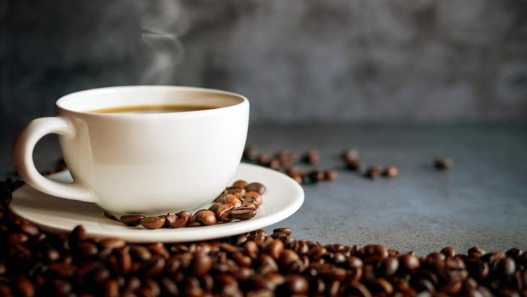 Coffee cup and coffee beans on  gray background&comma; Black coffee cup aromatic