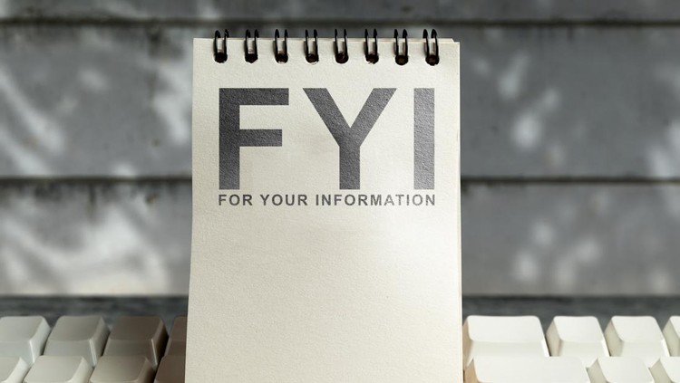 Notebook with the acronym FYI &lpar;For Your Information&rpar; is placed on an white keyboard&period; Ideal for business or educational content&period; Concept of For Your Information