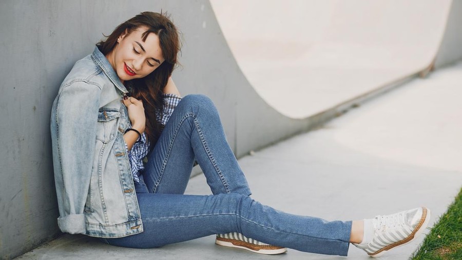 beautiful young and stylish girl in a summer city