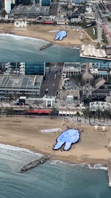 Aktivis Gelar Potret Raksasa Gadis Palestina di Pantai Barcelona