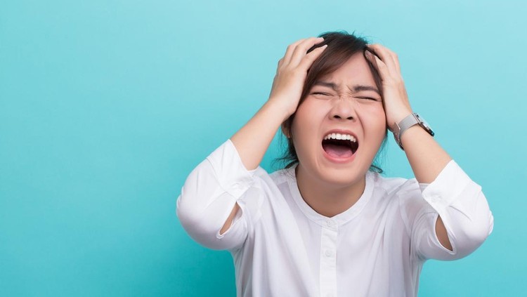 Angry woman on isolated background