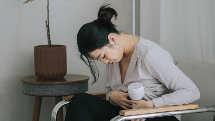 Asian pregnant women choosing a breast pump milk before give birth