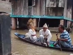 Viral Pengantin di PALI Tetap Gelar Resepsi Pernikahan di Tengah Banjir