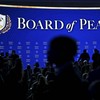 Visitors gather ahead of the Board of Peace meeting during the World Economic Forum (WEF) annual meeting in Davos on January 22, 2026. The World Economic Forum takes place in Davos from January 19 to January 23, 2026. (Photo by Fabrice COFFRINI / AFP