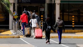 Travellers arrive at the airport as a strike by workers causes flight delays at the Jomo Kenyatta International Airport (JKIA) in Nairobi, Kenya, February 16, 2026. REUTERS/Monicah Mwangi