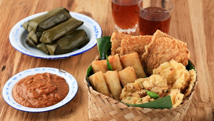 Various Gorengan for Takjil Breaking the Fast with Tea&comma; Lontong and Peanut Sauce