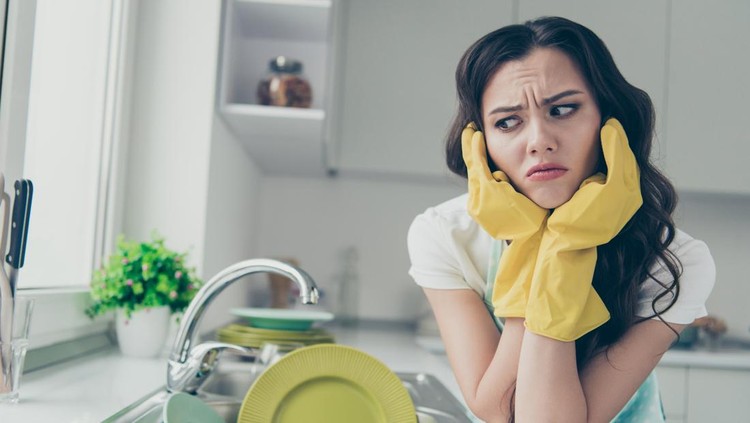 Close-up portrait of her she nice attractive beautiful caucasian annoyed irritated wavy-haired house-wife tired bored of polishing shine green plates in modern light white interior indoors