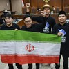 Terdakwa kasus dugaan penghasutan unjuk rasa, Delpedro Marhaen (kedua kiri), Muzaffar Salim (kiri), Syahdan Husein (kanan) dan Khariq Anhar (kedua kanan) membawa bendera Iran sebelum menjalani sidang putusan di Pengadilan Tipikor, Jakarta, Senin (19/