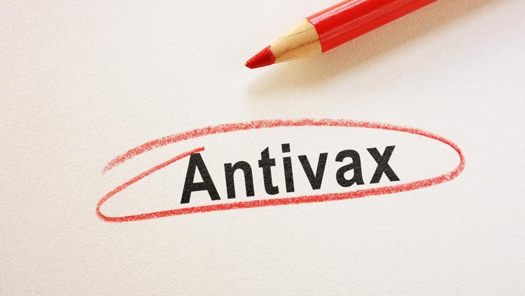 Antivax text circled in red with pencil on textured paper