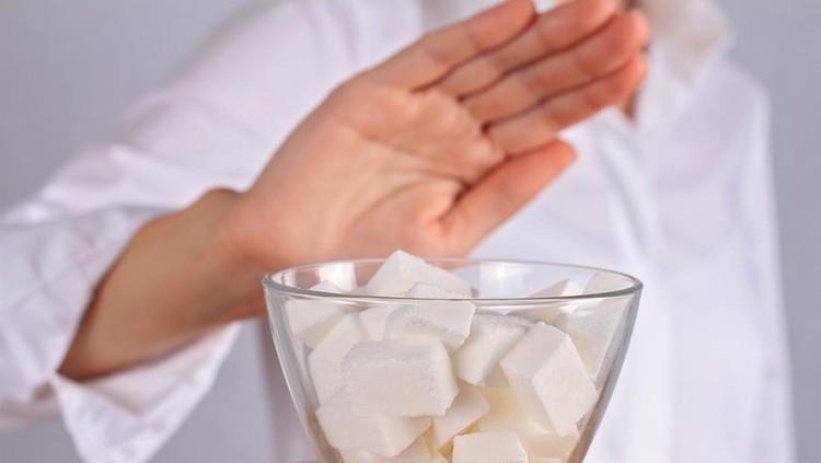 Woman refuses white sugar&period; Dieting&comma; Health care and diabetes prevention concept